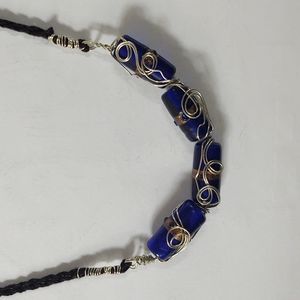 Hand crocheted blue glass beads